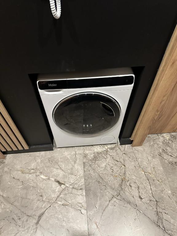 Shared washing machine on the floor